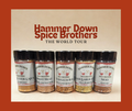 Collection of Hammer Down Spice Brothers spice jars on a beige background with text.